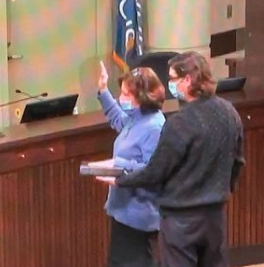 In January Commissioner Charlotte O’Hara was sworn in and wrote, "I stand here masked, a price extracted for an in-person swearing in to office, even though I fall into a category exempt from masks as I suffer from tinnitus. Those who are hearing impaired are exempt from the mask mandate as are those speaking to them.  My choice was to be sworn in virtually or wear the mask, capitulate and pay the entry fee to be sworn in in person.  I have chosen the later."