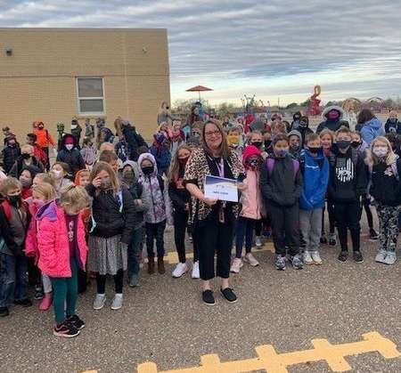 Wilson Elementary School Principal Anita Scheve with some of her students at Wilson Monday morning after receiving her Principal of the Year Award. Courtesy photo