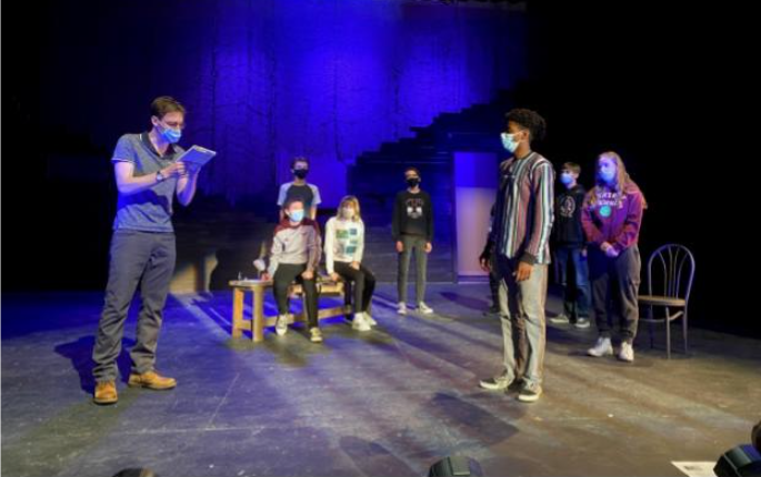 <b>Judge Danforth (Spencer Angell), left, questions John Proctor (Joshua Cunningham) in his cell, while imploring him to sign a confession to witchcraft during a recent rehearsal of "The Crucible." Also pictured, from left, are Charles Goldbach, Josh Warner, Hana North, Ethan Henry, Ben Campbell, and Sophie Lenkiewicz.</b> Photo courtesy Salina Central High School Theatre