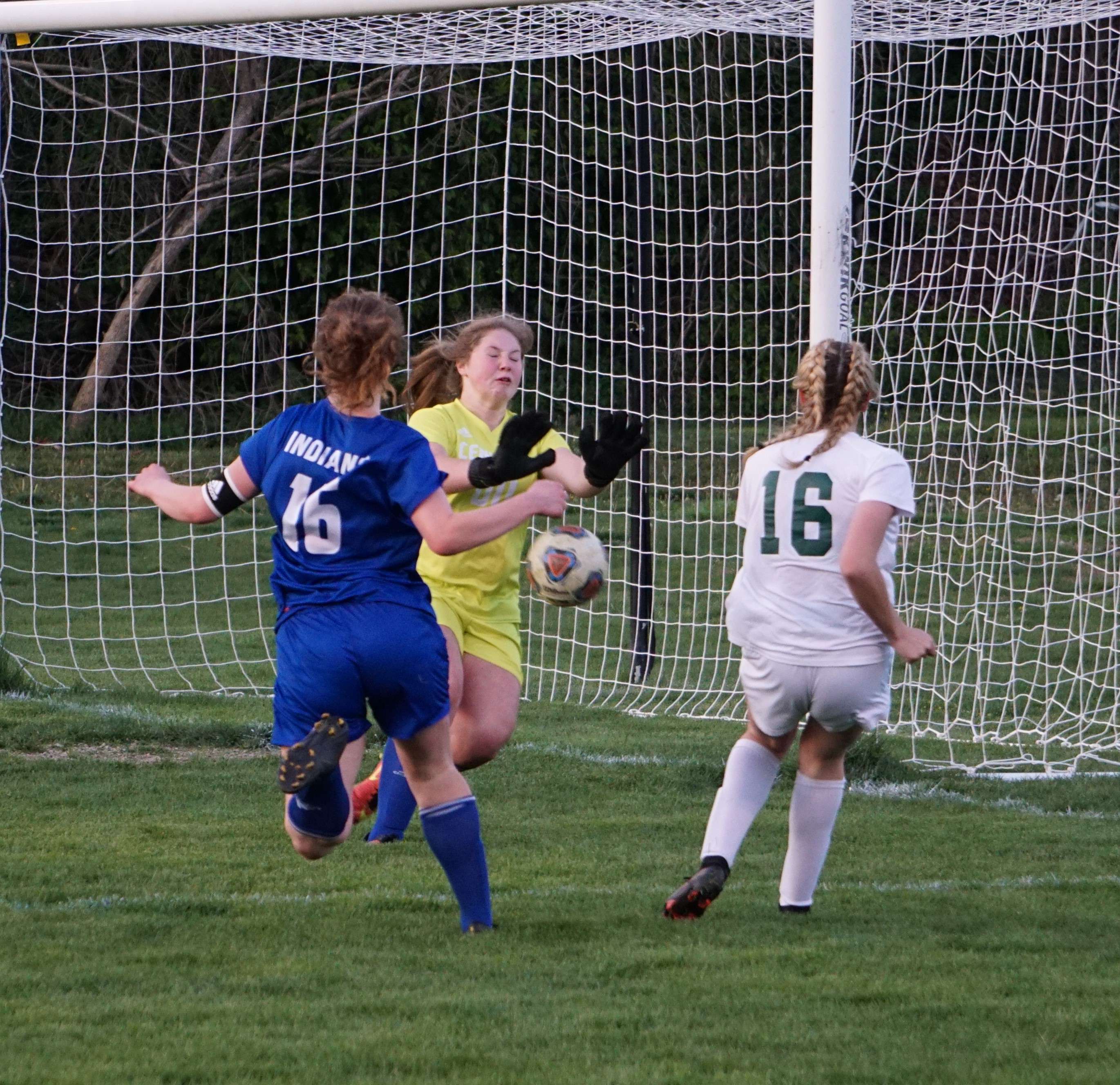 Central goalie Danielle Burg (yellow) blocks a shot from Staley's Jordan Bedard in the second half of Thursday's match. Photo by Tommy Rezac.