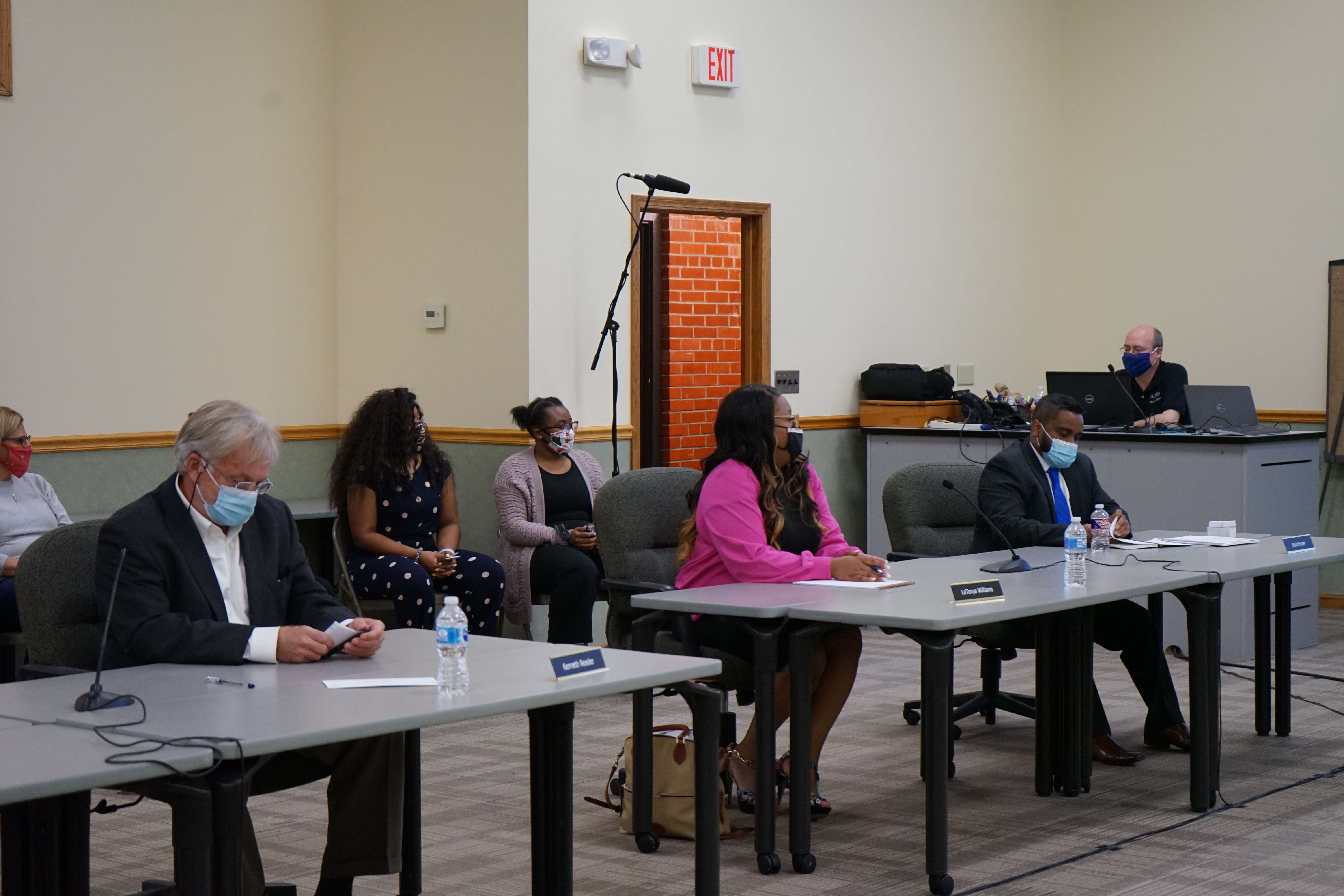 Newly inducted members: Kenneth Reeder, LaTonya Williams, and David Foster participate in their first school board meeting / Photo: Whitnee Ice