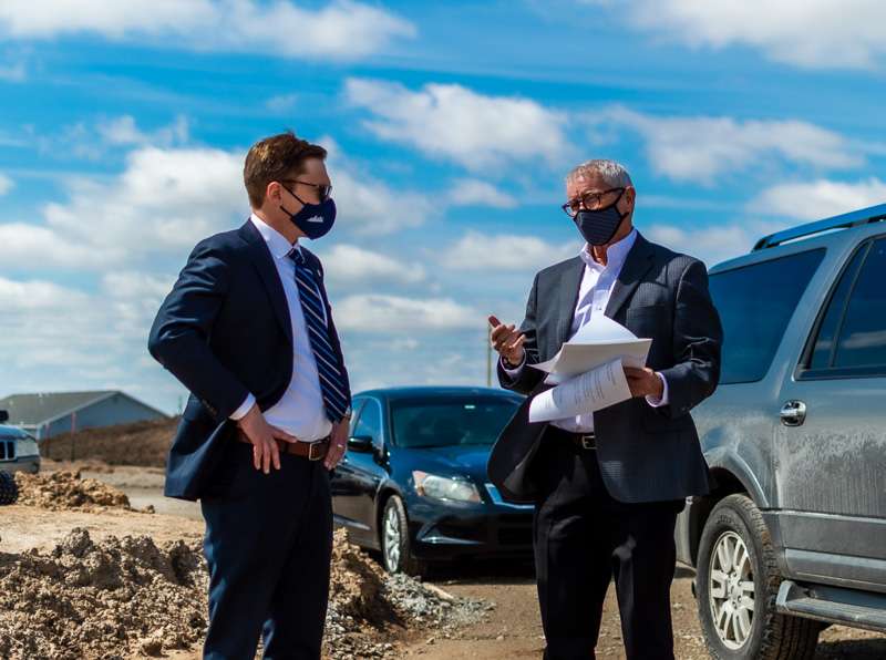 Lt. Gov. David Toland speaks with Grow Hays Executive Director Doug Williams at the site of a new housing development at 22nd and Wheatland in Hays.