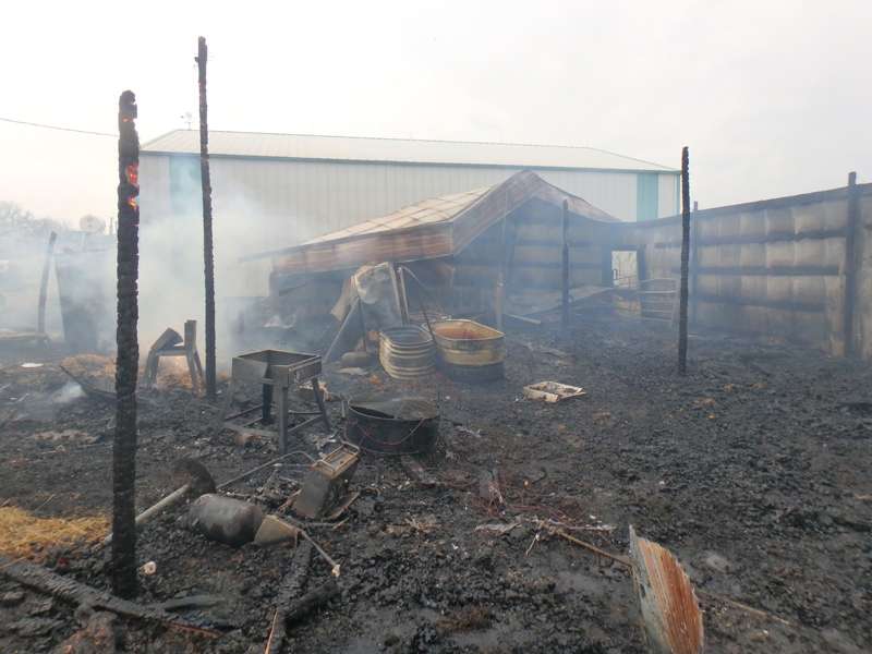 <b>Fire continues to glow inside a post in the remains of the building.</b> Photos courtesy Saline County Sheriff's office