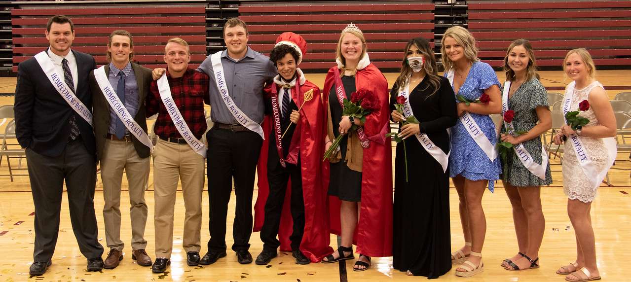 Chadron State College Homecoming Royalty at Coronation in the Chicoine Center April 21, 2021. From left, Attendants Brendan Fangmeier, Josslyn Linse, Caleb Haskell, Myles Mendell, King Damien Zuniga, Queen Emily Hansen, Attendants Ruth Mencia, Emily Hand, Annaliese Werner, and Carissa Radtke. (Tena L. Cook/Chadron State College)