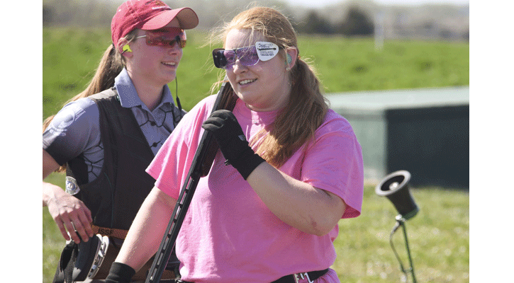 Morgan Krinke, right, of Lincoln Pius X, smiles after winning a shoot-off to take the ladies’ championship in the high school 16-yard competition at the 51st Cornhusker Trap Shoot on Friday at Doniphan, Nebraska. Kaylynn Sieber, of Marshall, Minnesota, left, finished second in the three-person shoot-off. (Nebraska Game and Parks Commission)