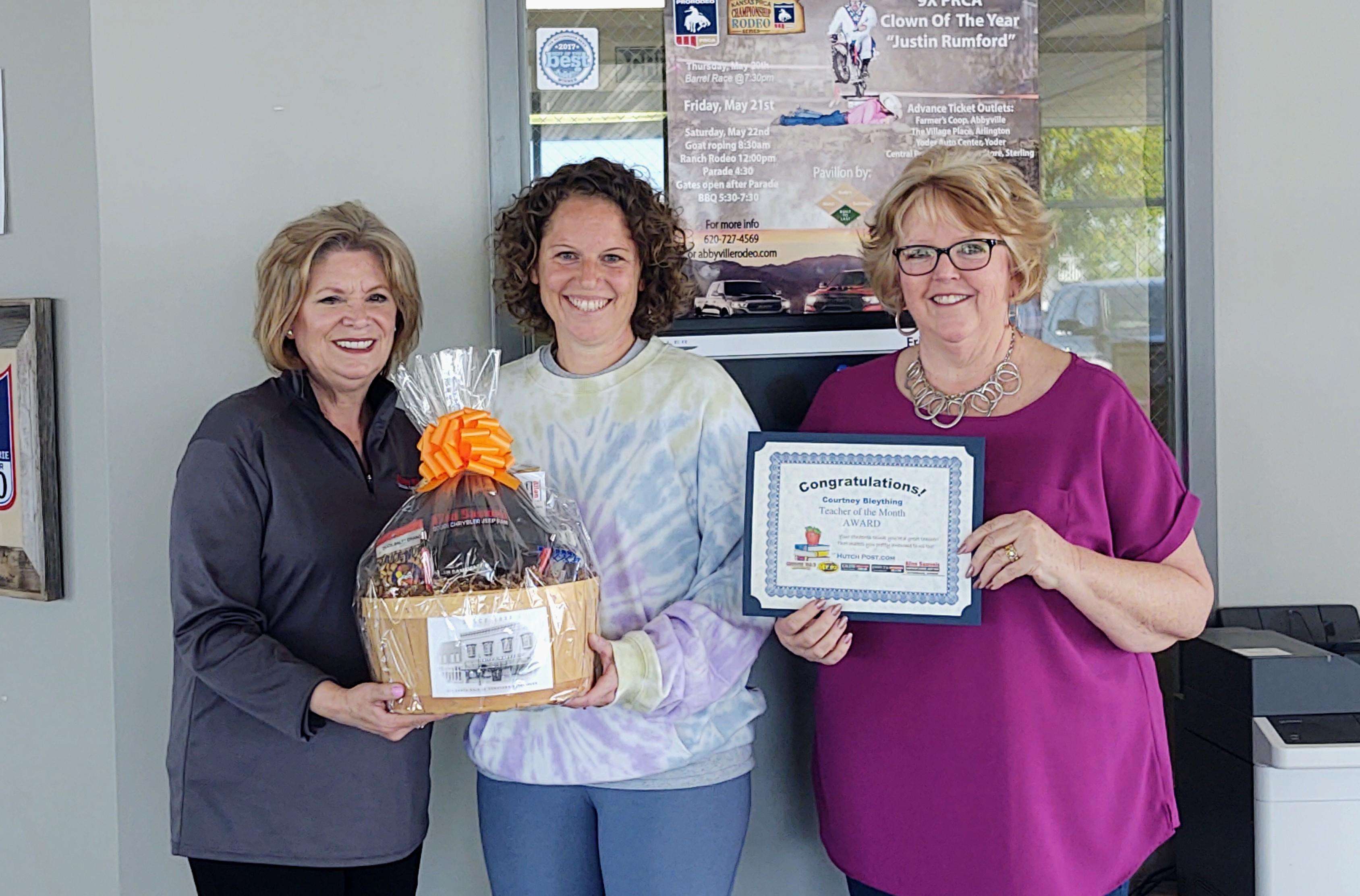 Chris Schul from Allen Samuels CDJR, Teacher of the Month Courtney Bleything and Eagle Communications General Manager Nancy Swain