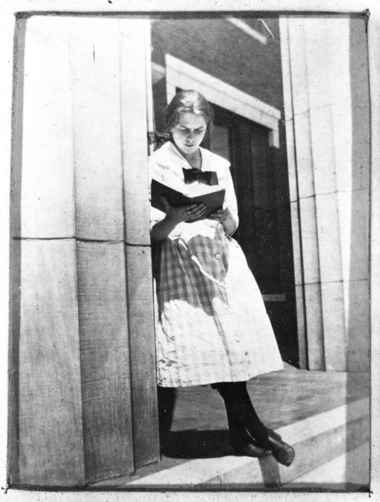 <b>Her father described Mary White as loving books, and here she strikes a studious pose. Her crossed ankles and casual stance, however, hint at a playful and sometimes mischievous personality.</b> Photo courtesy Kansas State Historical Society