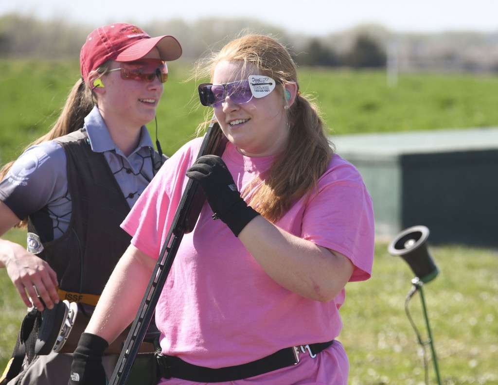 Morgan Krinke, right, of Lincoln Pius X, smiles after winning a shoot-off to take the ladies’ championship in the high school 16-yard competition at the 51st Cornhusker Trap Shoot on Friday at Doniphan, Nebraska. Kaylynn Sieber, of Marshall, Minnesota, left, finished second in the three-person shoot-off. (Nebraska Game and Parks Commission)