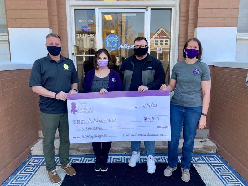 <b>Dalton Ramsey, third from left, seen here with representatives of Ashby House and the Greater Salina&nbsp; Community Foundation, helped Ashby House land a $5,000 grant for its drug and alcohol treatment transitional housing program.</b> Photo courtesy K-State Polytechnic
