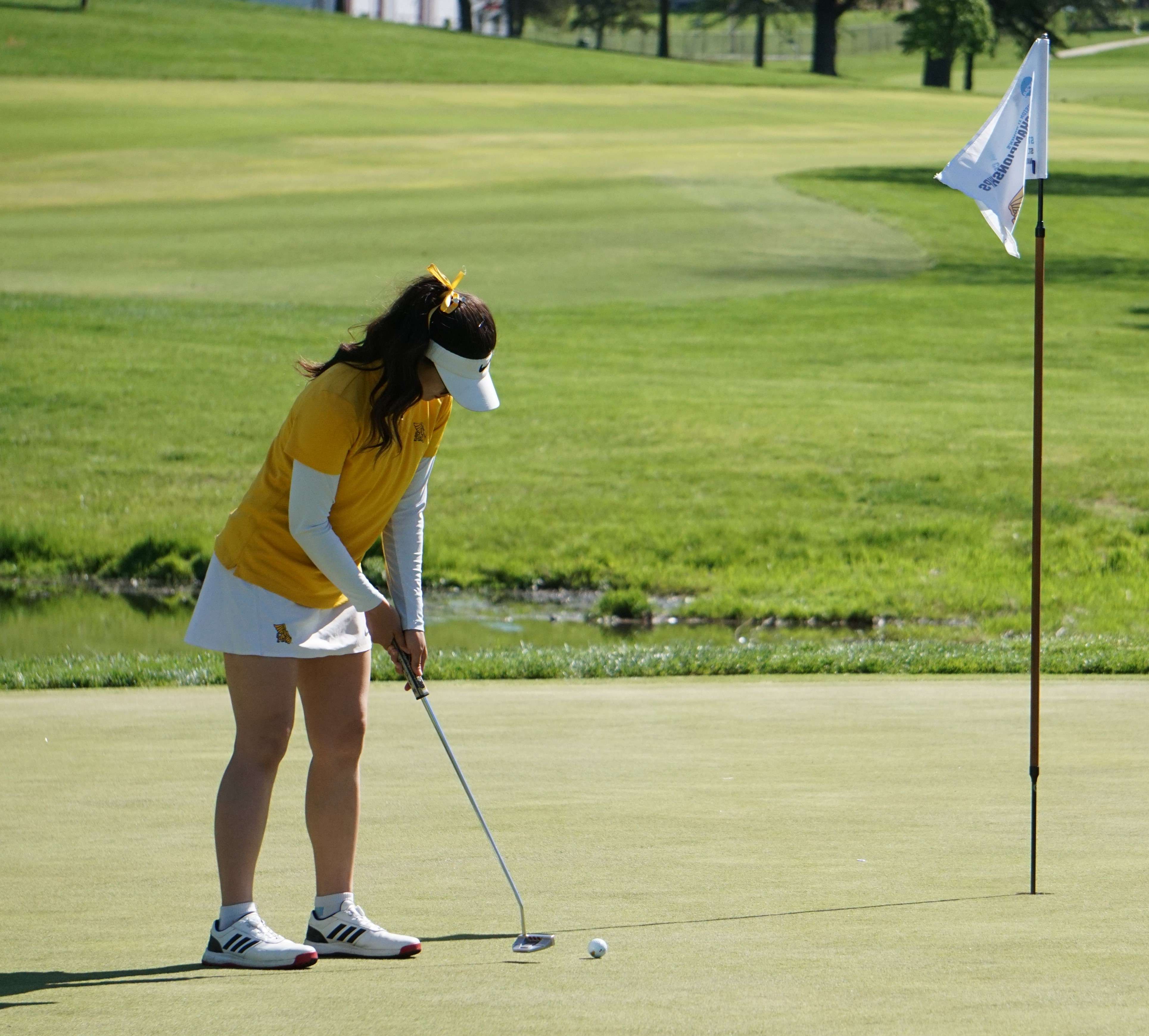 Missouri Western golfer Allycia Gan putts on the front nine during Wednesday's NCAA Central Regional tournament at the St. Joseph Country Club. Photo by Tommy Rezac.