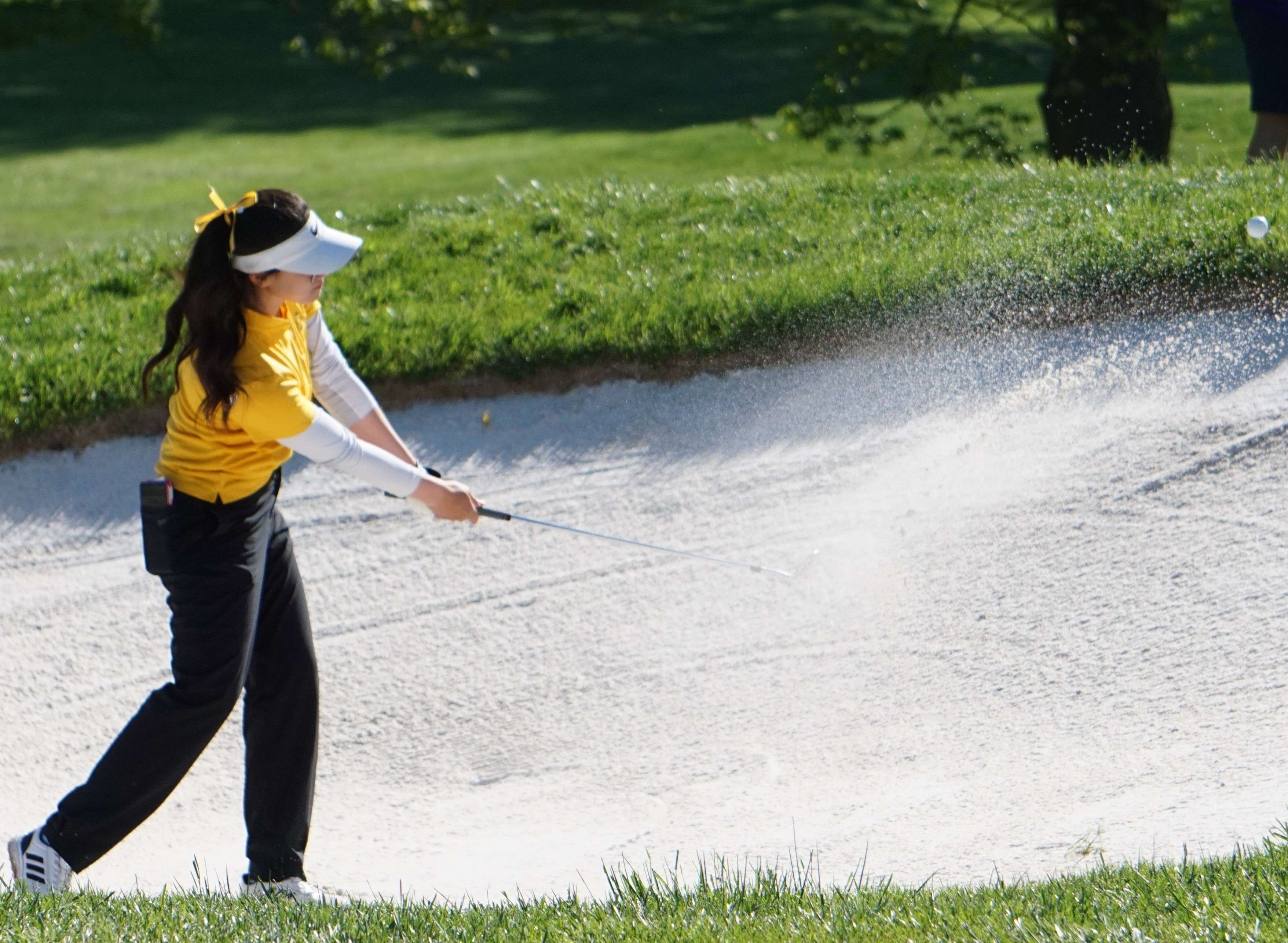 Missouri Western golfer Allycia Gan hits a ball out of the sand trip on the second hole during Wednesday's NCAA Central Regional at St. Joseph Country Club. Photo by Tommy Rezac.