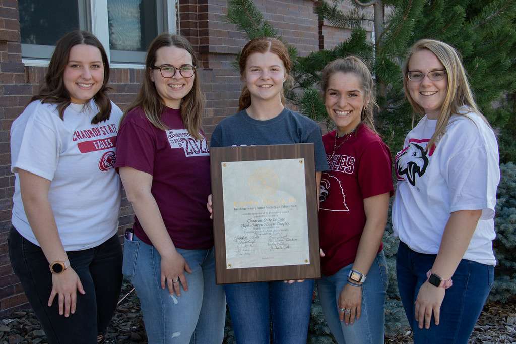 &nbsp; Chadron State College students who are charter members of the Alpha Kappa Kappa chapter of the Kappa Delta Pi , international honor society in education, pose north of Old Admin April 29, 2021. From left, Ebawnee Smercina of Craig, Colo., Rayleigh Farrenkopf of Bridgeport, Neb, JoAnn Neel of McCook, Neb., Ashley Anderson of Ashby, Neb., and Hope Stone of Maywood, Neb. Robin Brierly is the adviser of the group. Not pictured: Olivia Albright.&nbsp;<a href="https://www.kdp.org/">https://www.kdp.org/</a>&nbsp;(Tena L. Cook/Chadron State College)&nbsp;&nbsp;