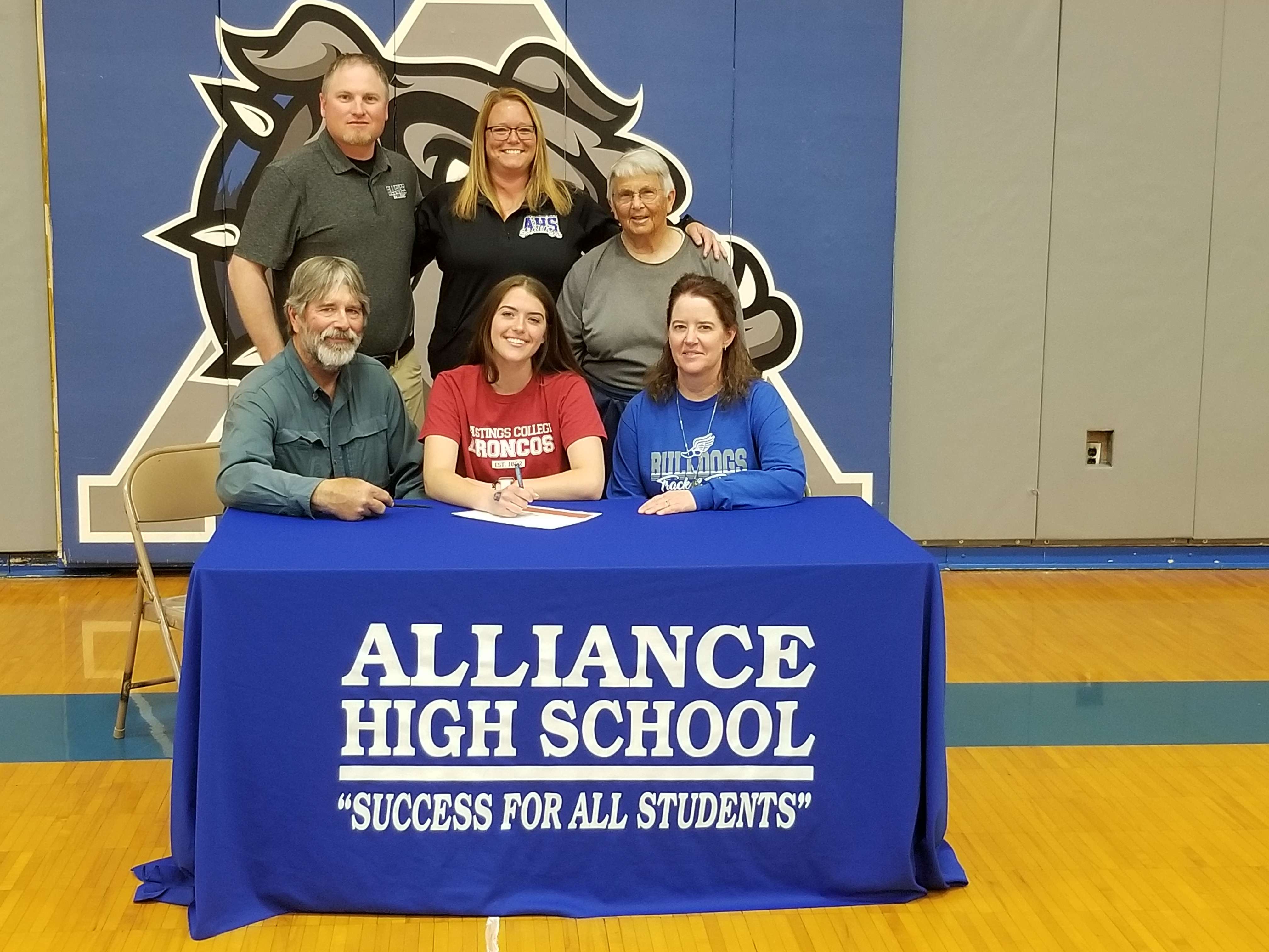 Front L-R: Tim Kollars, Diana Kollars, Renee Kollars.&nbsp; Back L-R: AHS Head Track Coach Nate Lanik, Coach Kelly Erickson, Coach Sandra Pilfold