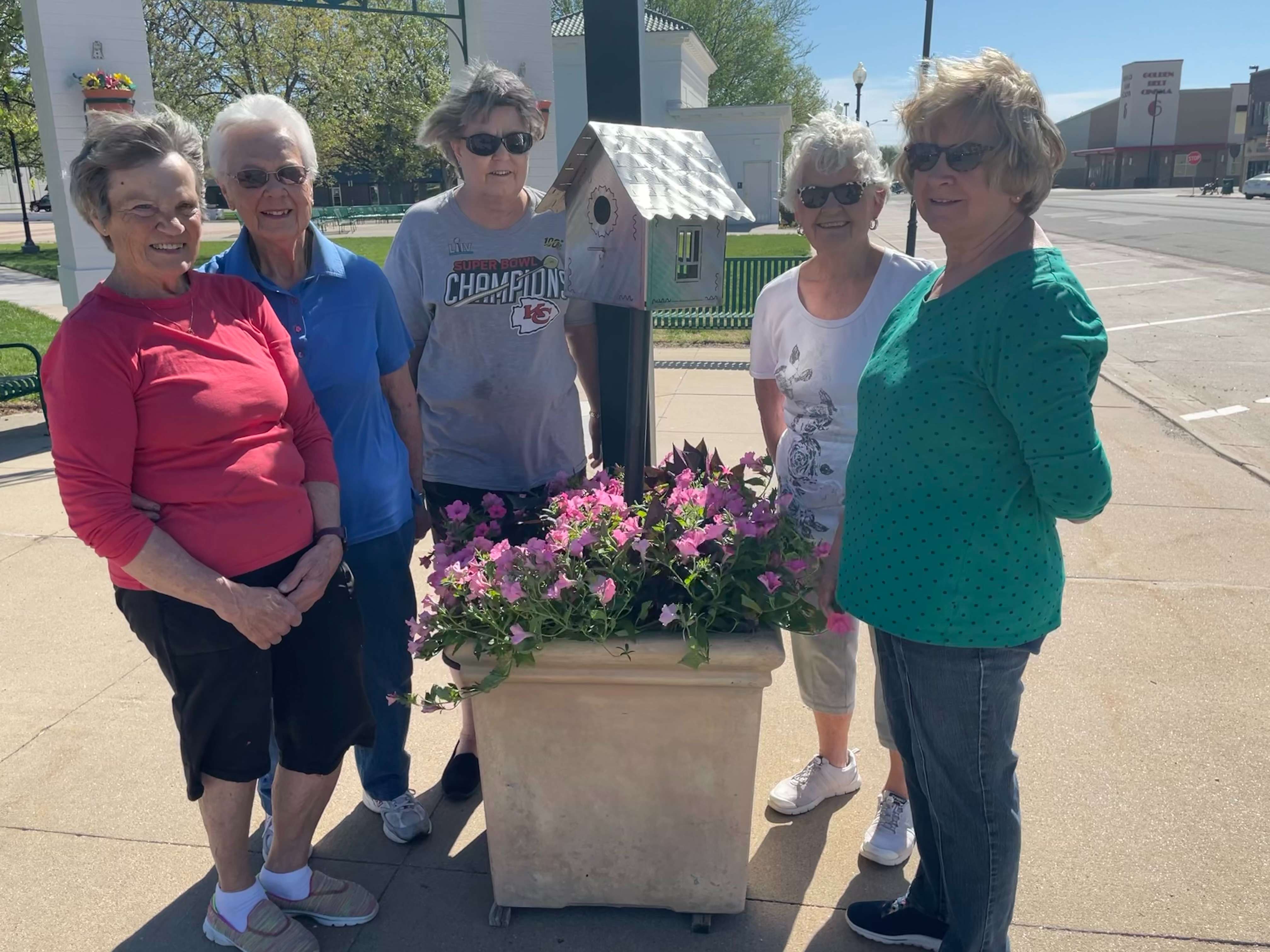 Beautification Committee members gather around one of 13 planters decorated on May 1, 2021. From left to right: Carol Schremmer, Dorothy Piland, Janice Williams, Linda Dougherty, and June Hillman.