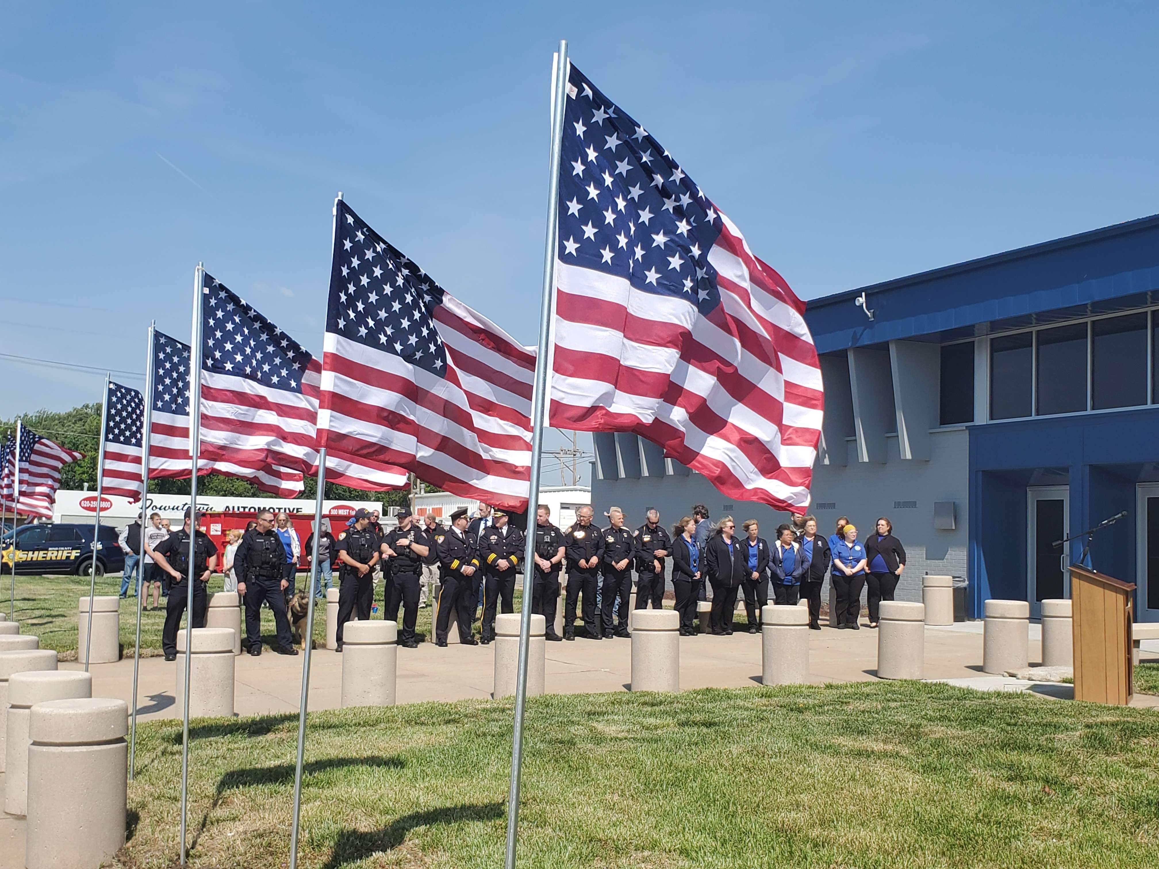 Officers gather on a windy Friday morning to honor those killed in the line of duty.