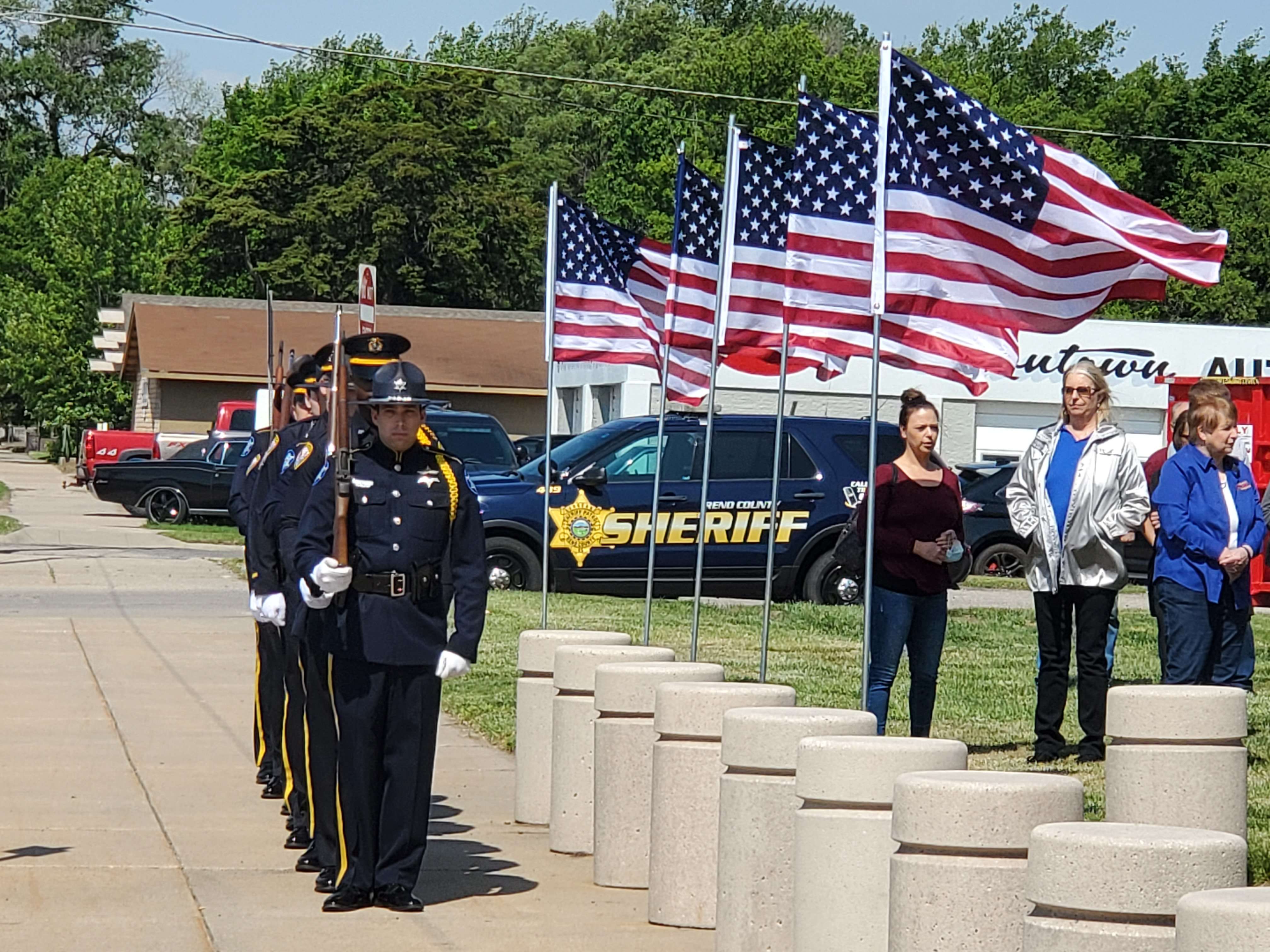 The honor guard presented the colors Friday. While Art Sundquist performed Taps, the flag was raised to full-staff before being lowered to half-staff to honor officers who died in the line of duty.
