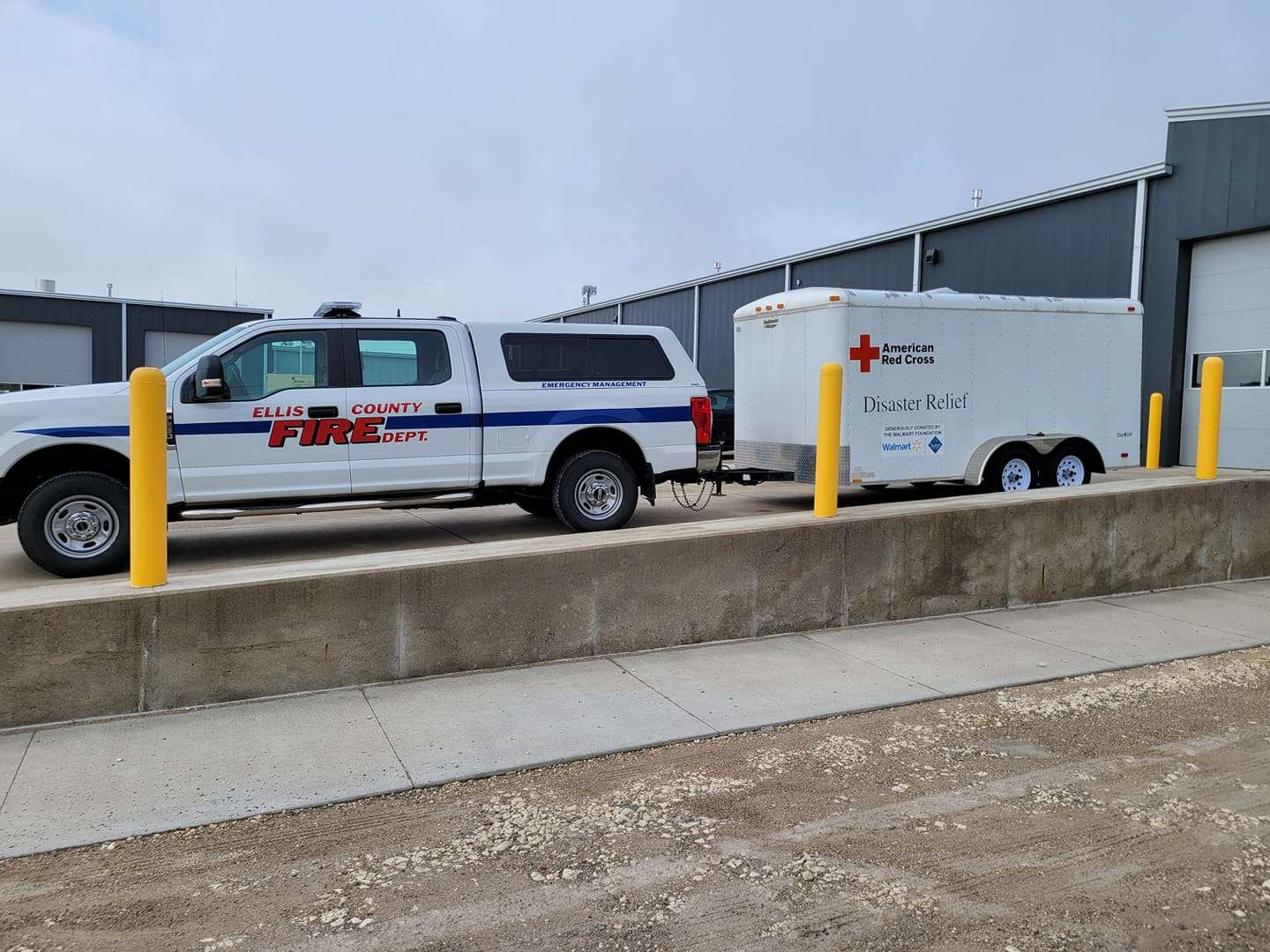 Ellis County fire department prepares to help move the Ellis County American Red Cross Disaster Relief trailer to Natoma where flash flooding was reported Sunday morning. (Photo courtesy Ellis County FD)