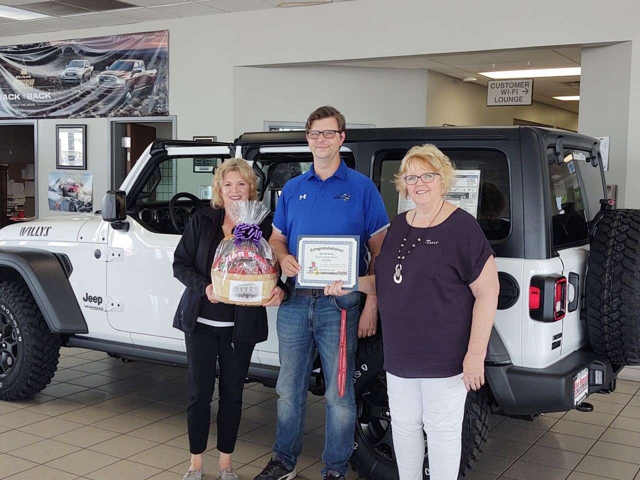 Cris Schul from Allen Samuels, Dan Brinkley from Reno Valley Middle School, Nancy Swain from Eagle Communications