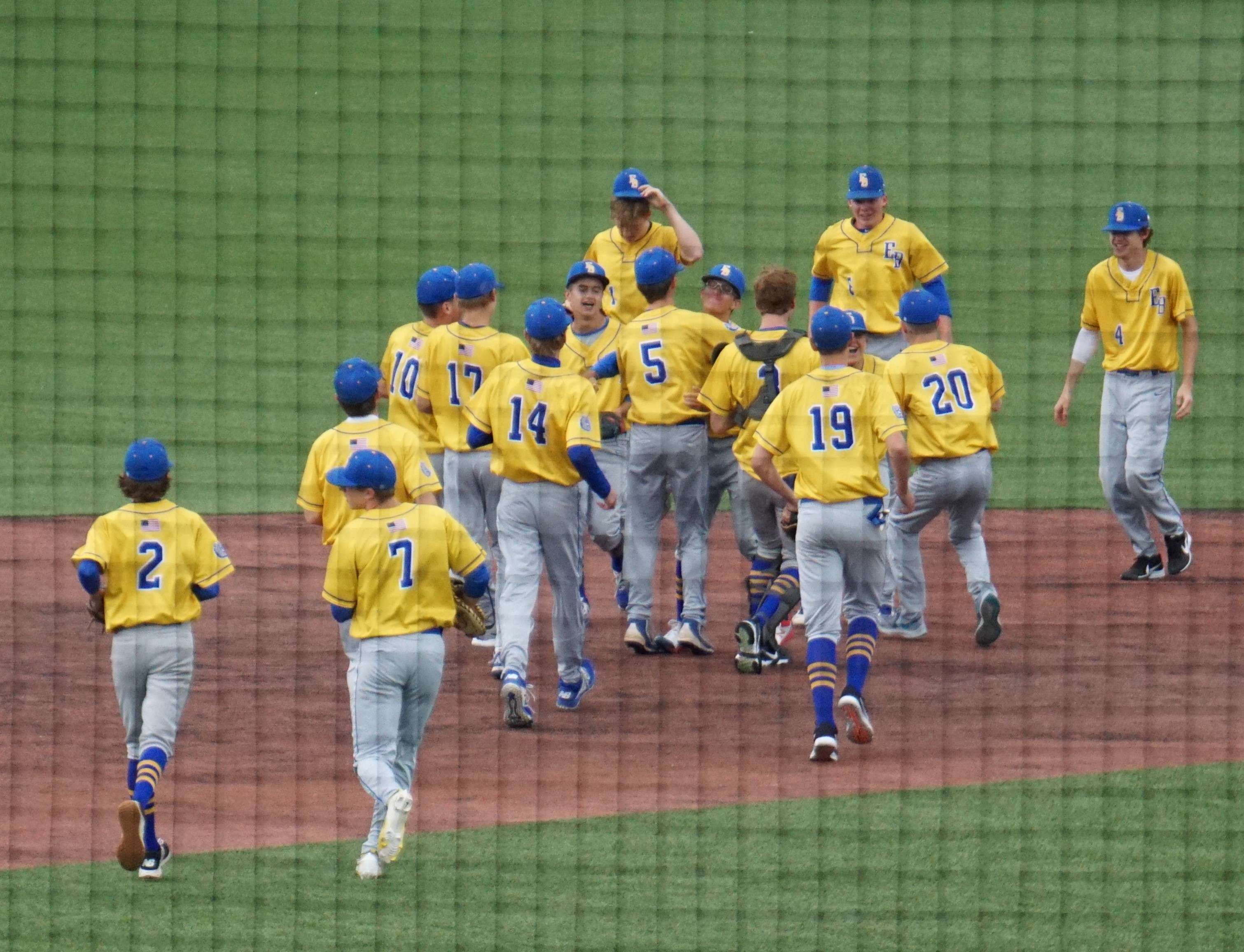 East Buchanan celebrates on the field after Monday's win.