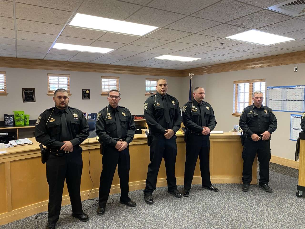 Lieutenant / Captain promotion recipients and Lieutenant Mark Maschmeier and Undersheriff Eric Coffman ( R ) in the photo.