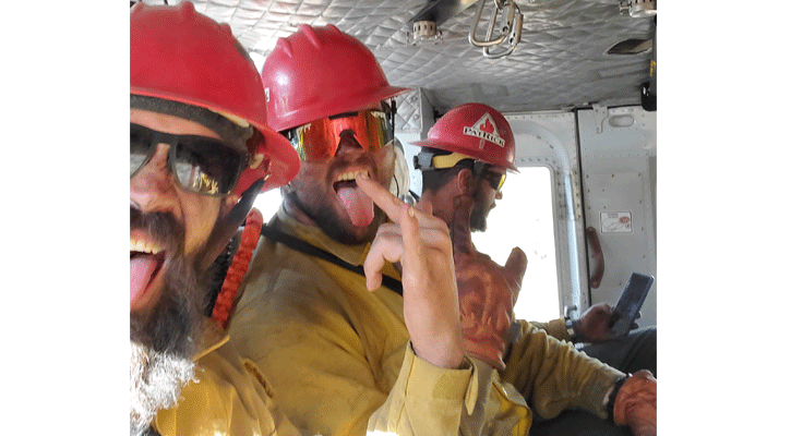 North Platte native Mark Hooper (left) and his crew onboard a helicopter heading to battle a wildfire in Nevada.