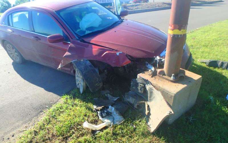 <b>The car the teens were in came to a stop at the base of a light pole. </b>Photo courtesy Saline County Sheriff's Office