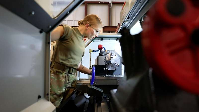 <b>Sergeant Autumn Cash, 91E Advanced Leaders Course student from the Maine Army National Guard, works with a CNC lathe as part of the course curriculum at the Kansas Army National Guard’s Regional Training Site for Maintenance in Salina on May 20.</b>