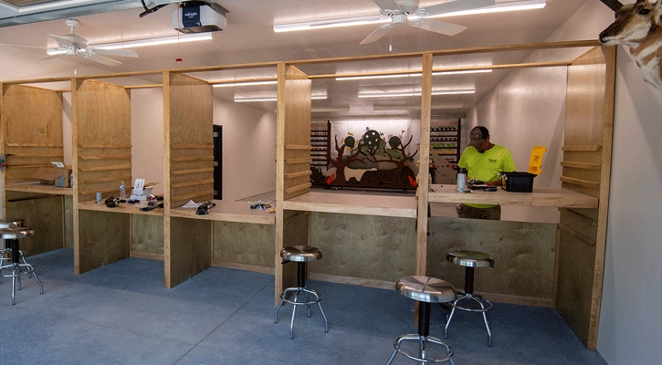 Andy Hendrickson of Fuller Construction installs the air system for the pellet gun range. (NGPC/Justin Haag)