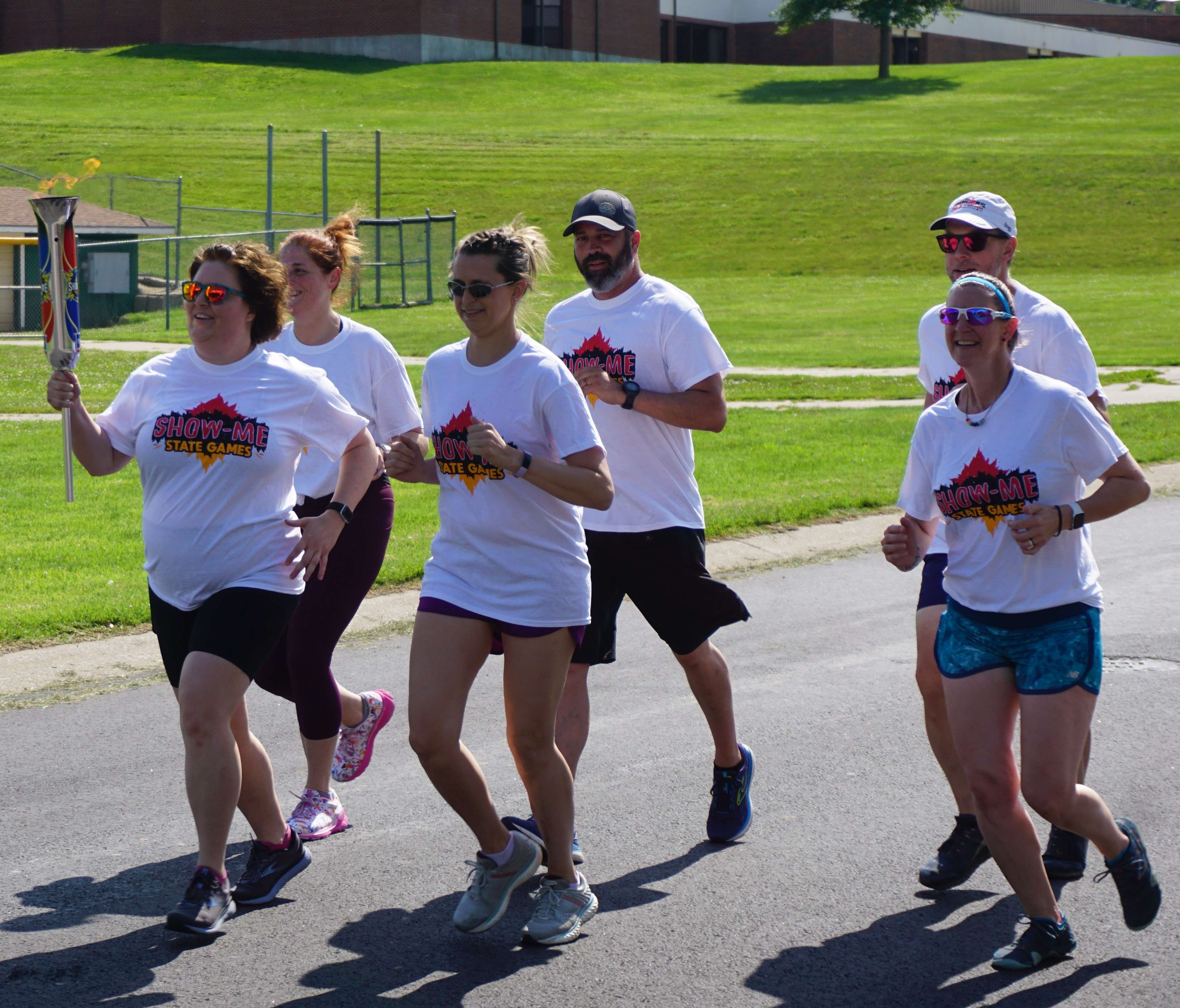 St. Joseph community members ran a lap around Bartlett Park Monday with the Show-Me State&nbsp; State Games ceremonial torch in hand. Photo by Tommy Rezac.