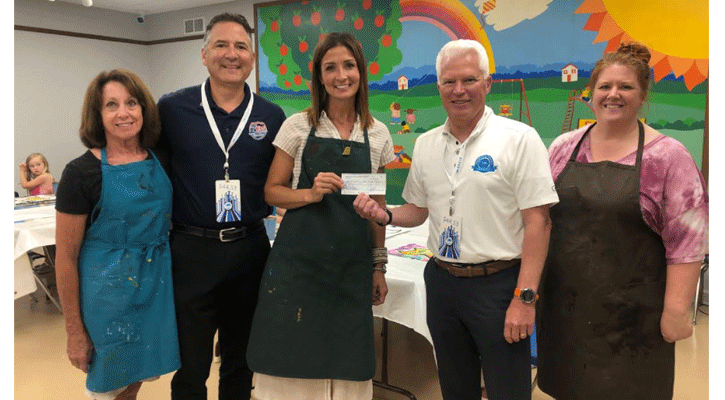Shorman and Eagle North Platte General Sales Manager Lewys Carlini present a donation to PAC. Accepting the donation were PAC Board member Charlene Schneider, Carlini and PAC Art Sales Associate Tara Lienemann.