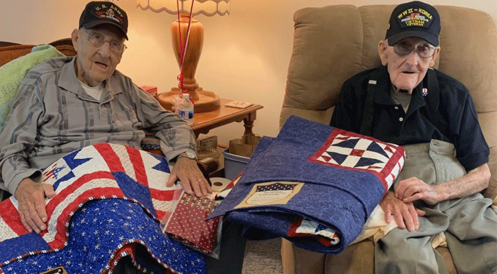 Bill Cooper, 85, left, of North Platte and Alvin Cooper, 96, of Uehling received Quilts of Valor with friends and family present on June 11.<br>