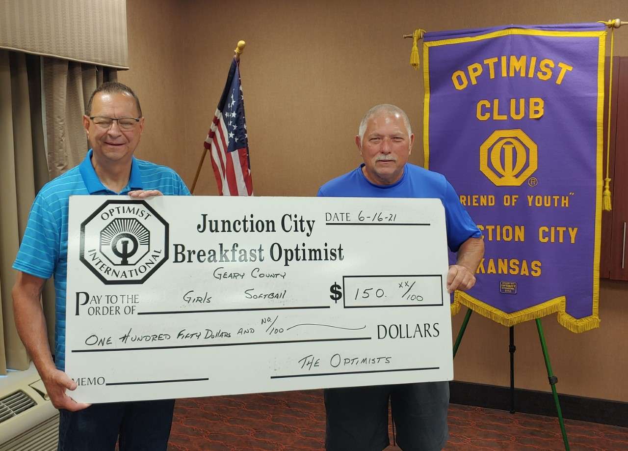 ( L - R ) Breakfast Optimist Club President Don Manley and Geary County Girls Softball Association President Jeff Childs.
