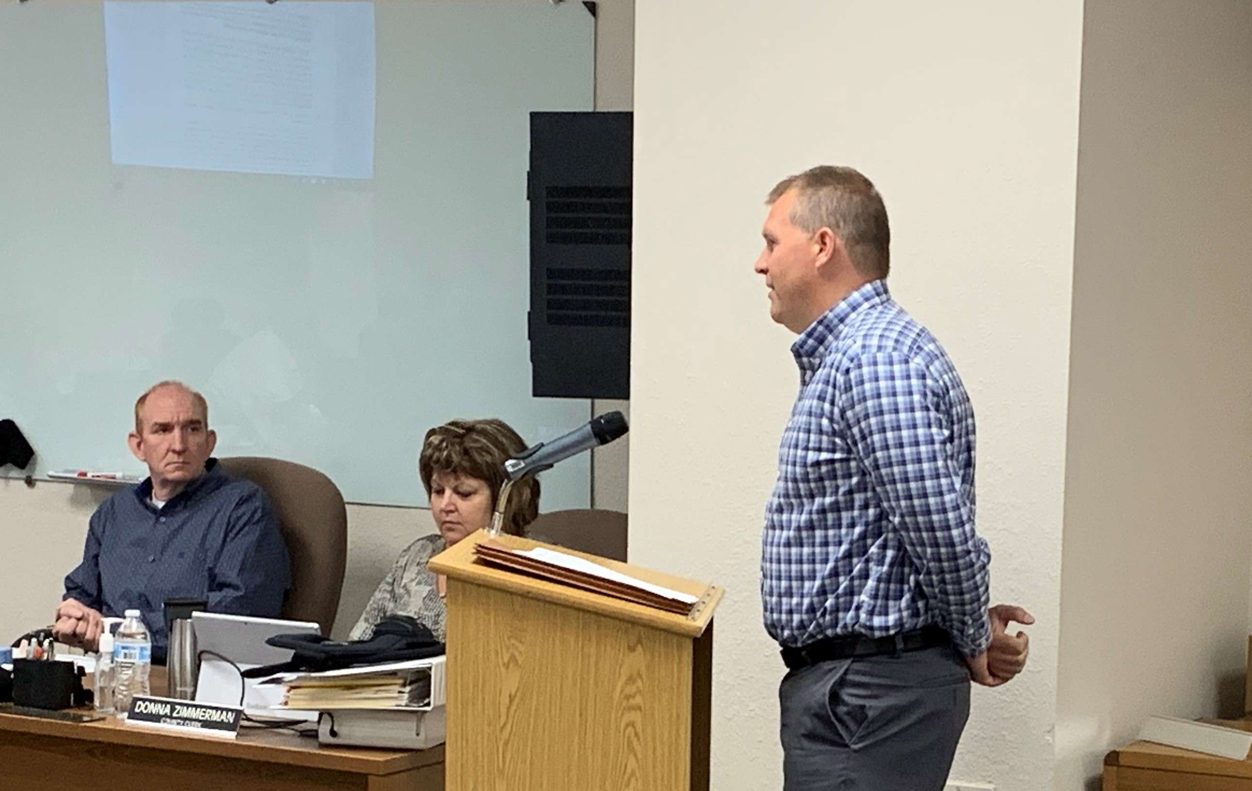 Barton County Counselor Patrick Hoffman (right) discusses liquor law changes with Barton County Commissioners on Monday, June 21, 2021.