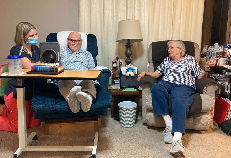 <i><b>Verl and Betty Eckman, of Abilene, appreciate the opportunity to visit with Verl’s doctor during a telehealth visit facilitated by Home Health and Hospice of Dickinson County nurse Melissa Peterson, RN.</b> Photos courtesy Memorial Health System</i>