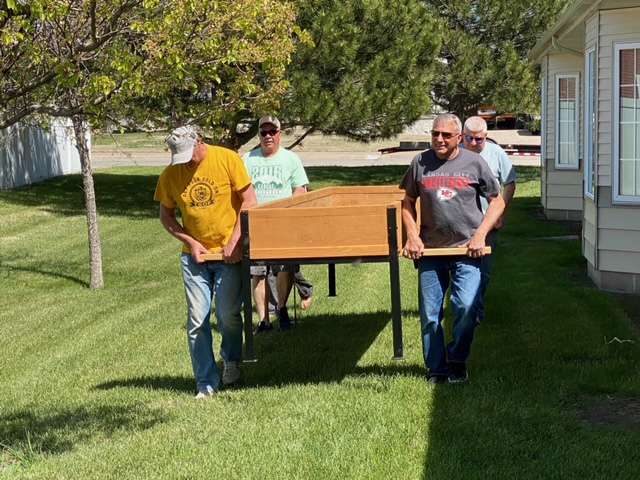 Volunteers place one of the garden beds donated by the Wonder Women League to a Hays care home. Courtesy photo