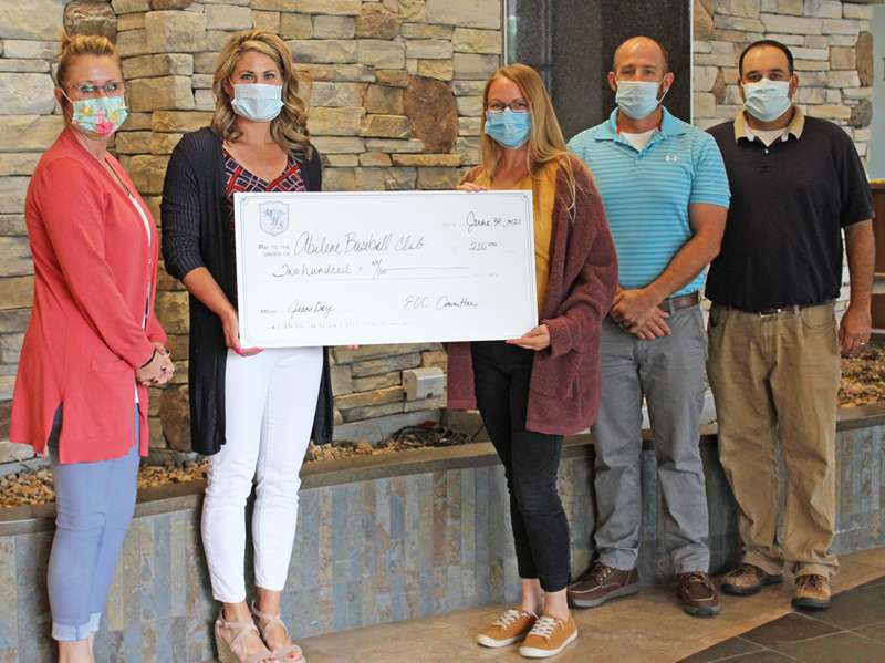<b>Memorial Health System (MHS) employees donated to the Abilene Baseball Club. </b><i><b>Pictured from left are: Jenn Chaput, EOC committee member; Kim Bartley, ABC Logistics Officer; Traci Jurgensen, EOC committee member; Cy Taylor, ABC President and 9U coach; and Billy Hansen, 18U coach. </b>Photo courtesy MHS</i>