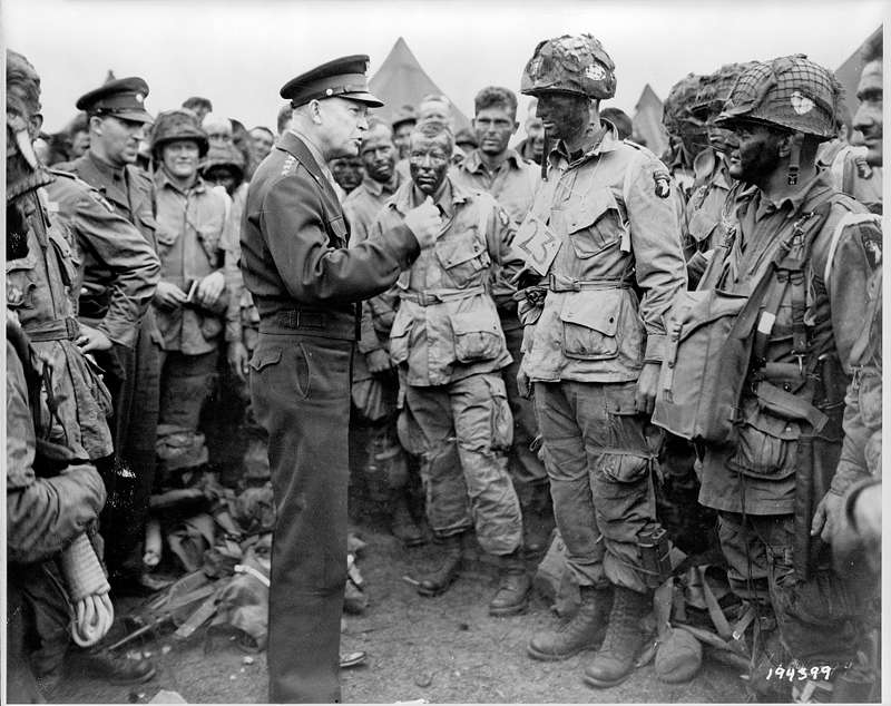 <b>Gen. Dwight Eisenhower speaks with American paratroopers in England on the evening of June 5, 1944, as they prepare for the Battle of Normandy. Presidential historians assembled by C-SPAN rated Eisenhower 5th in terms of presidential leadership. President Harry Truman ranked 6th.</b> (Library of Congress)