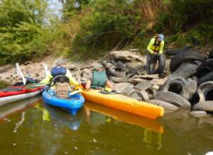 <b>Friends of the Kaw has collaborated for years with city and state government officials as well as non-government organizations and volunteers to haul away unsightly piles of tires from banks and sand bars of the Kansas River.</b> (Lisa Grossman)
