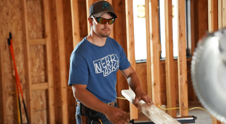 <i>Mid-Plains Community College student Matt McClung, of Big Springs, prepares to cut a board in a building construction class in North Platte. Building construction is one of the program areas eligible for Nebraska Career Scholarships.</i>