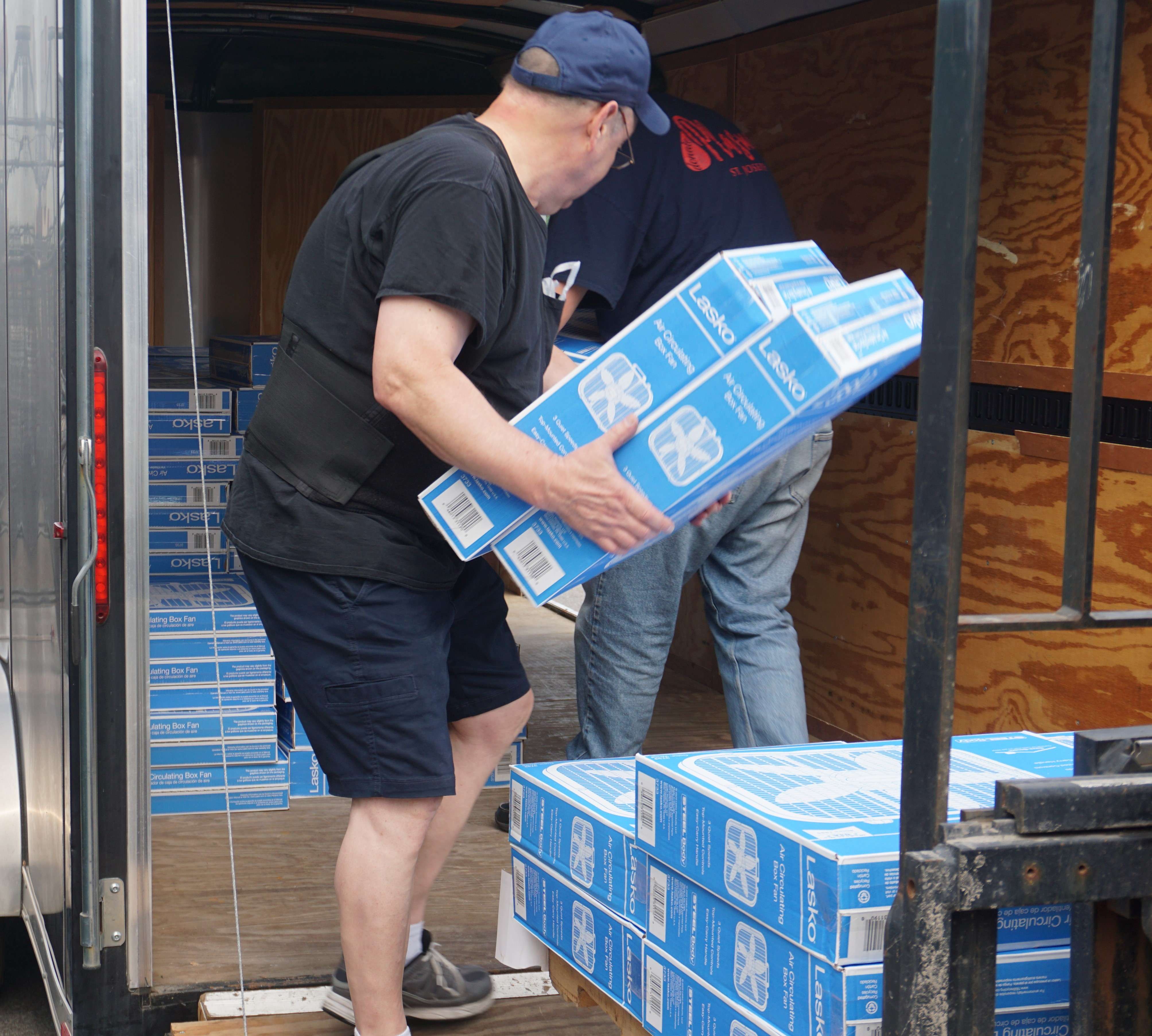143 box fans from Westlake Ace Hardware that were bought by donated money from customers are loaded into a trailer that will be taken to the St. Joseph Salvation Army, where those who might need a fan can pick one up for free. Photo by Tommy Rezac.
