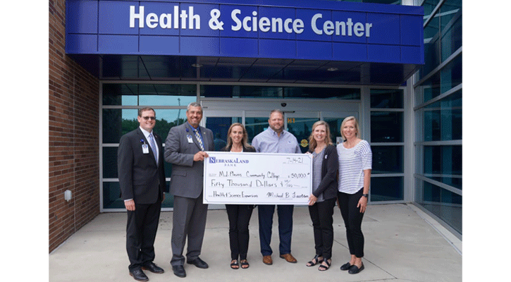 <i>Representatives from NebraskaLand Bank present a check to North Platte Community College Wednesday to assist with the Health and Science Center expansion project. Pictured left to right are: college officials Jacob&nbsp;Rissler, director of Institutional Advancement; Ryan Purdy, president, and Dr. Jody Tomanek, vice president of Academic Affairs and NPCC, along with bank representatives Ty Lucas, executive vice president and chief lending officer; Kim Schroll, executive vice president and chief operating officer, and Krista Heiss, executive vice president and chief credit officer.</i>
