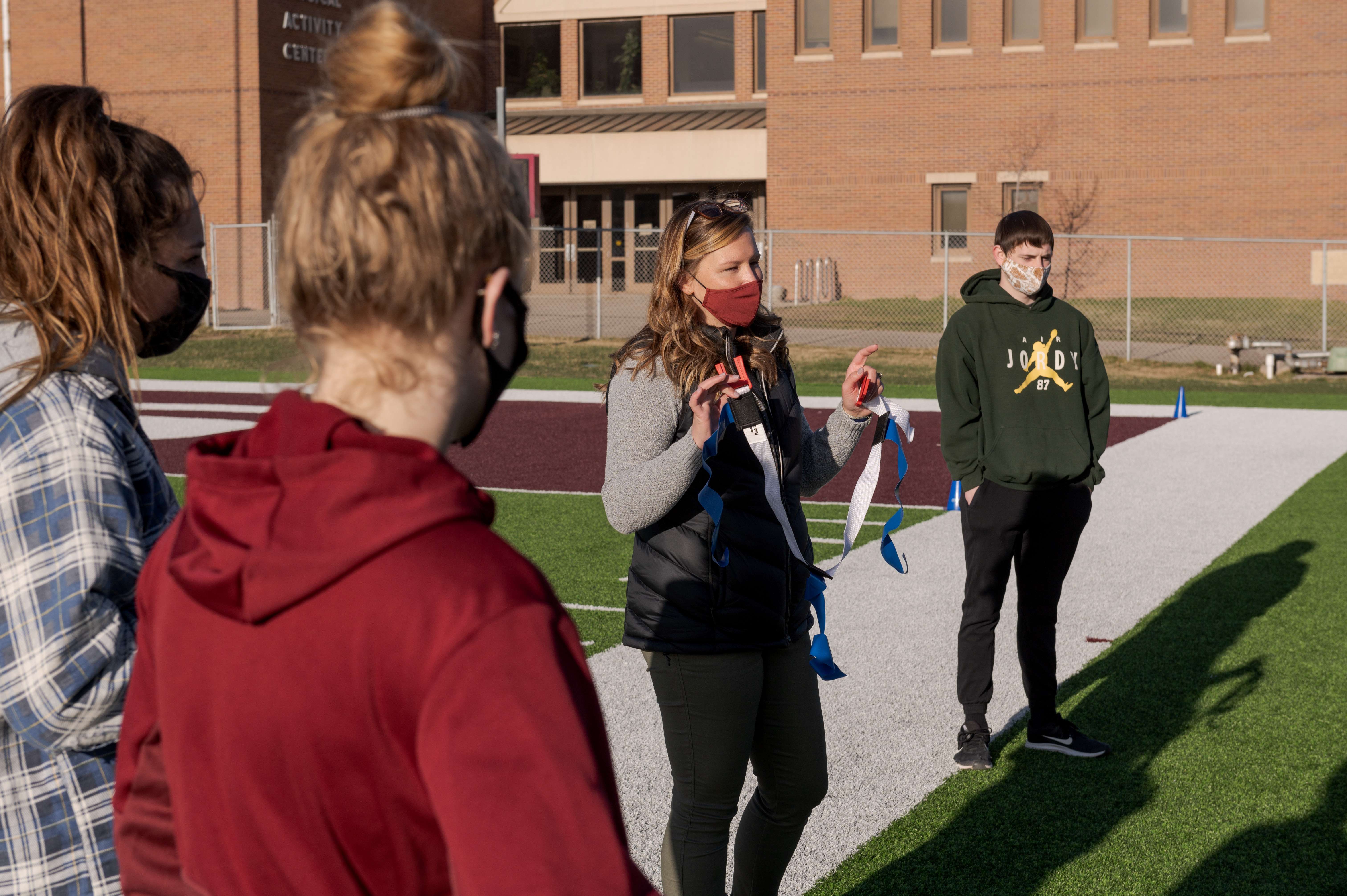 Dr. Brittany Helmbrecht, assistant professor of health, physical education, and recreation, speaks to her HPER 207 Team Sports Activities class in April 2021. (Photo by Daniel Binkard/Chadron State College)