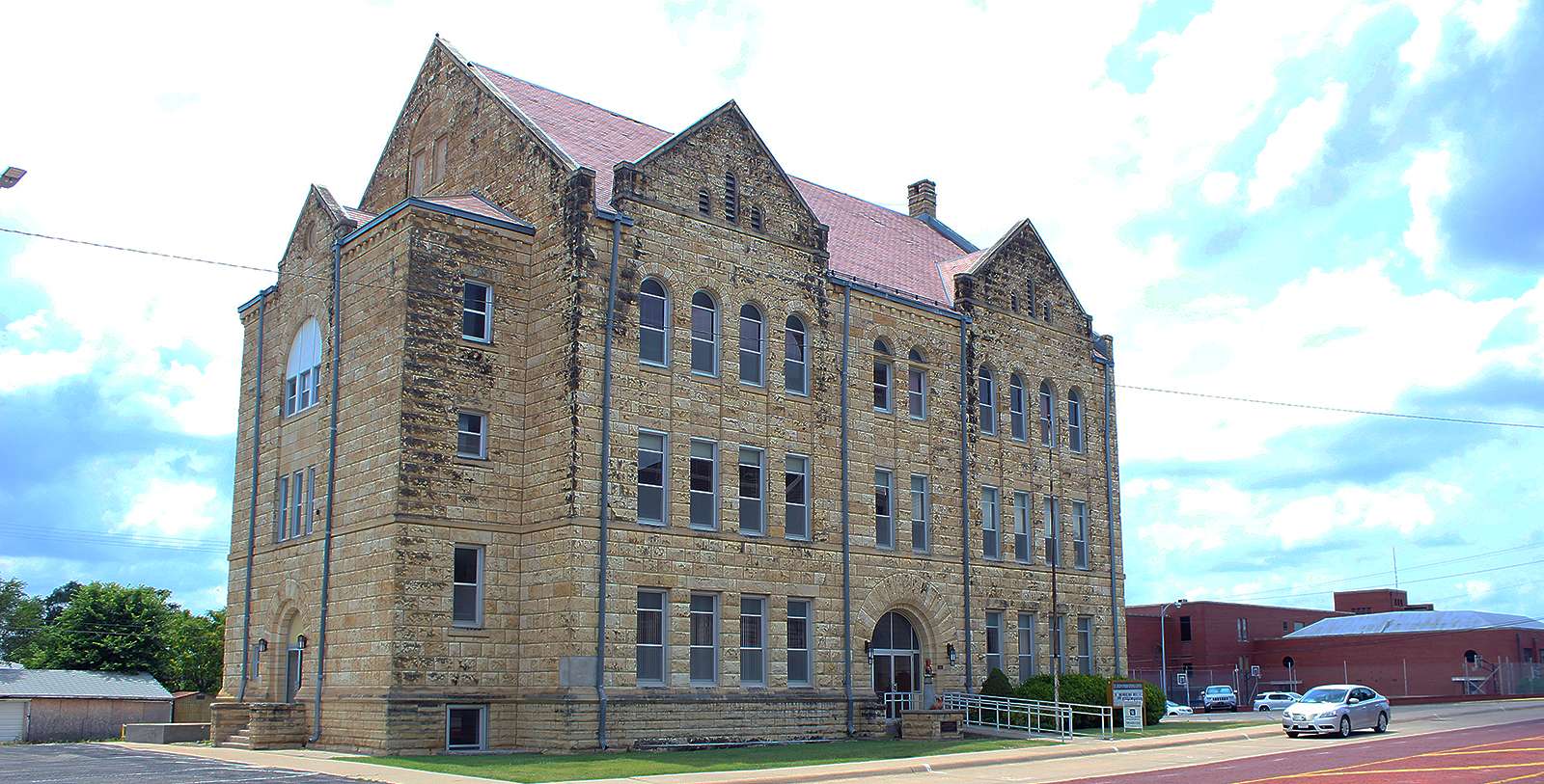 The former St. Joseph School/Parish Center, 210 W. 13th Street, is in the National Register of Historic Places. Owned by the Salina Catholic Diocese, it's been vacant for five years. An Atchison developer hopes to renovate the limestone building for multi-family housing. (Photo by Cris Janney/Hays Post)&nbsp;