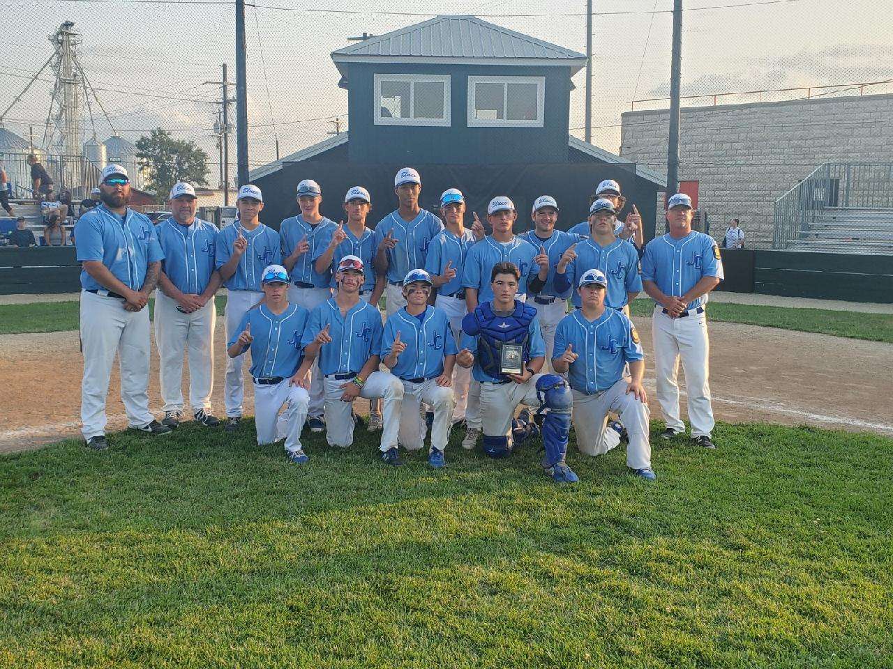 Junction City Blues pose after their zone championship win over the Salina Hawks