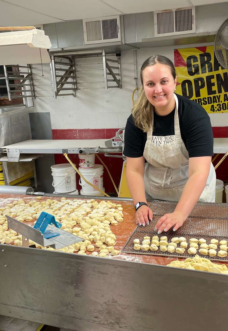 <b>Adelaide Easter, who concludes a decade-long career in Kansas 4-H this summer, learns how to make donuts for the Tri-Rivers Fair.</b> Photo courtesy Adelaide Easter