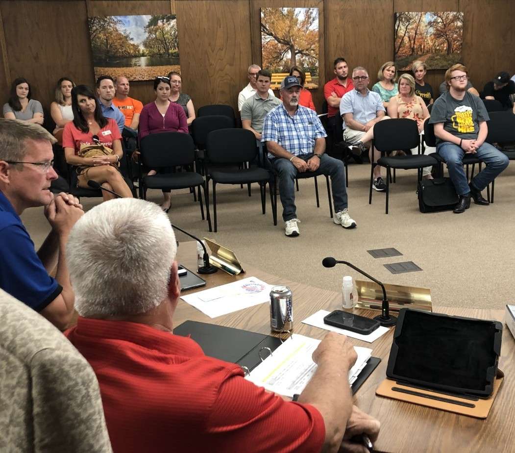 Board members, merchants and other supporters of the Downtown Hays Development Corp. listen to discussion by the city commission Thursday about city funding for the nonprofit group in the 2022 budget. 
