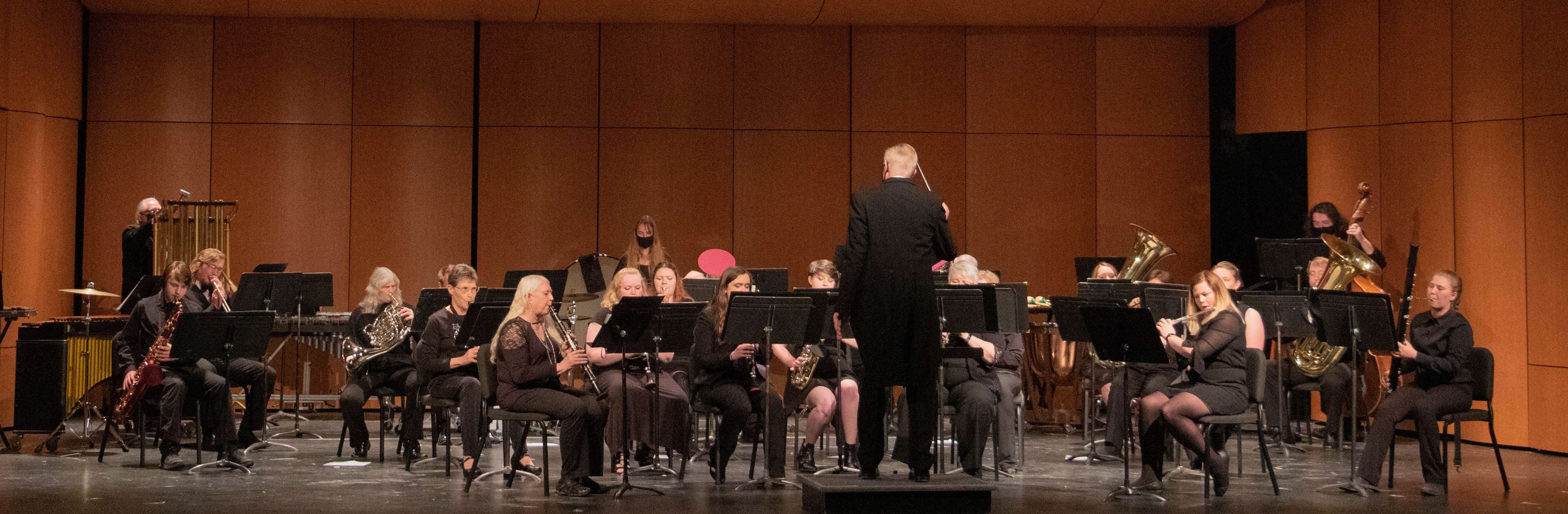 The Chadron State College Community Band, directed by John Wojcik, center, performs April 9, 2021, in Memorial Hall. (Tena L. Cook/Chadron State College)
