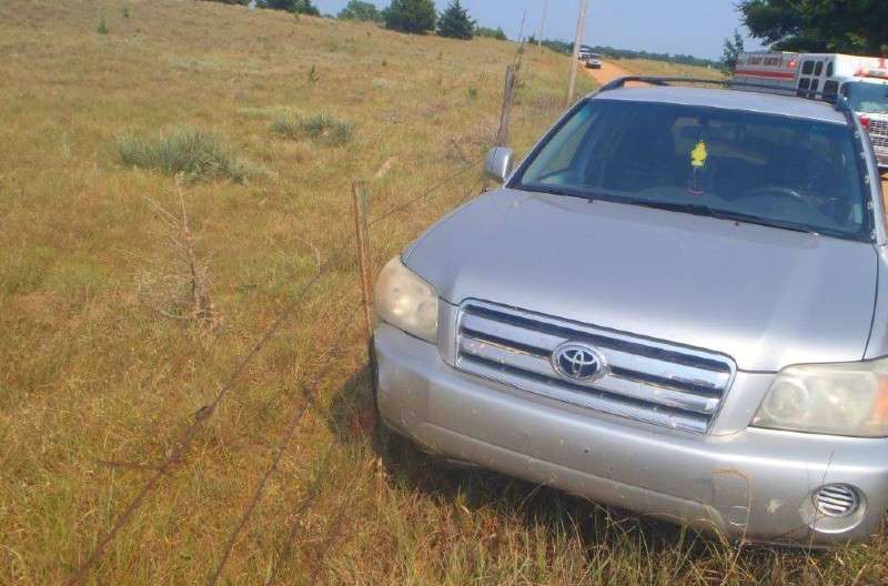 <b>The SUV came to rest against a metal fence post.</b> Photo courtesy Saline County Sheriff's Office