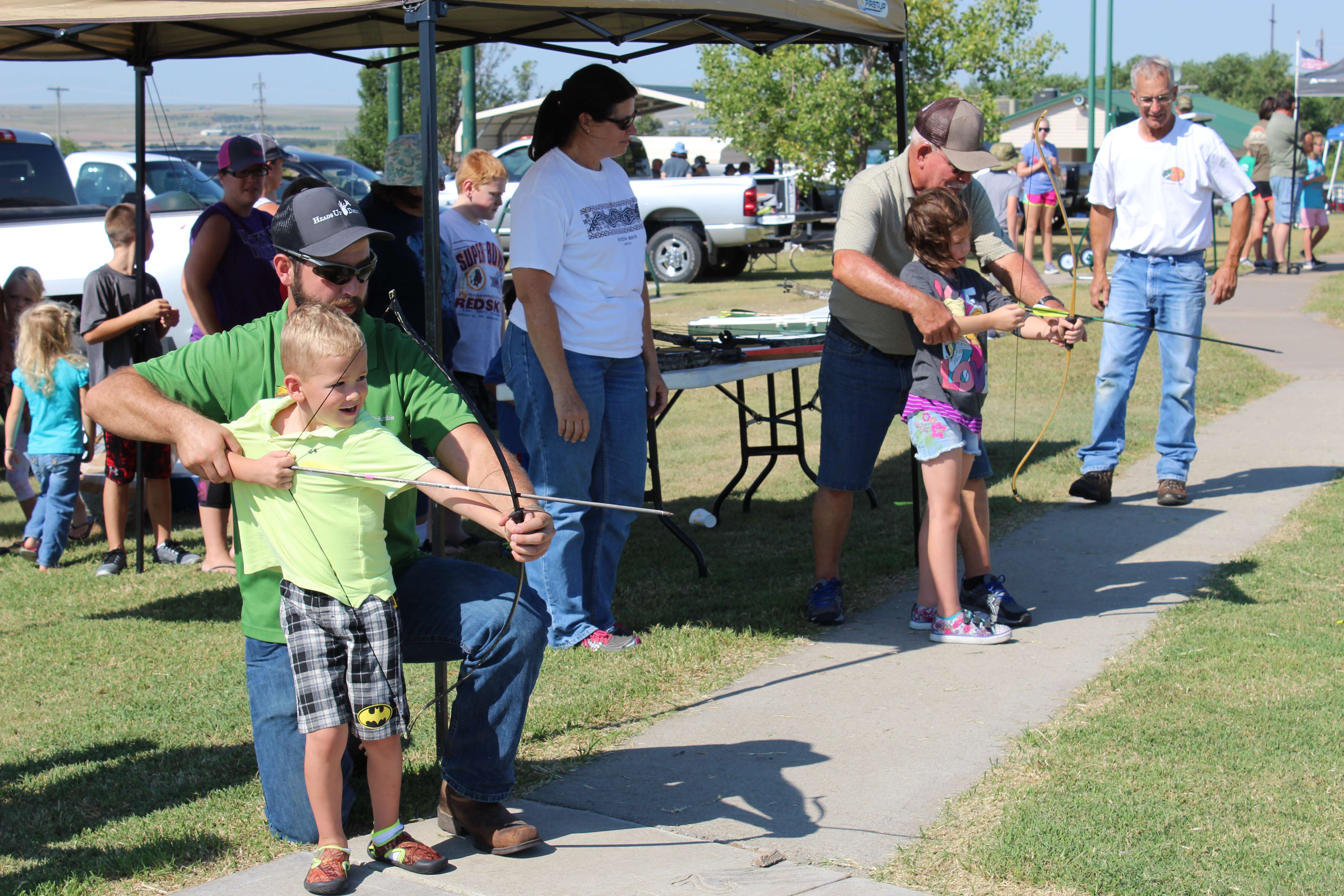 Children participate in archery during a past Youth Outdoor Festival. File photo