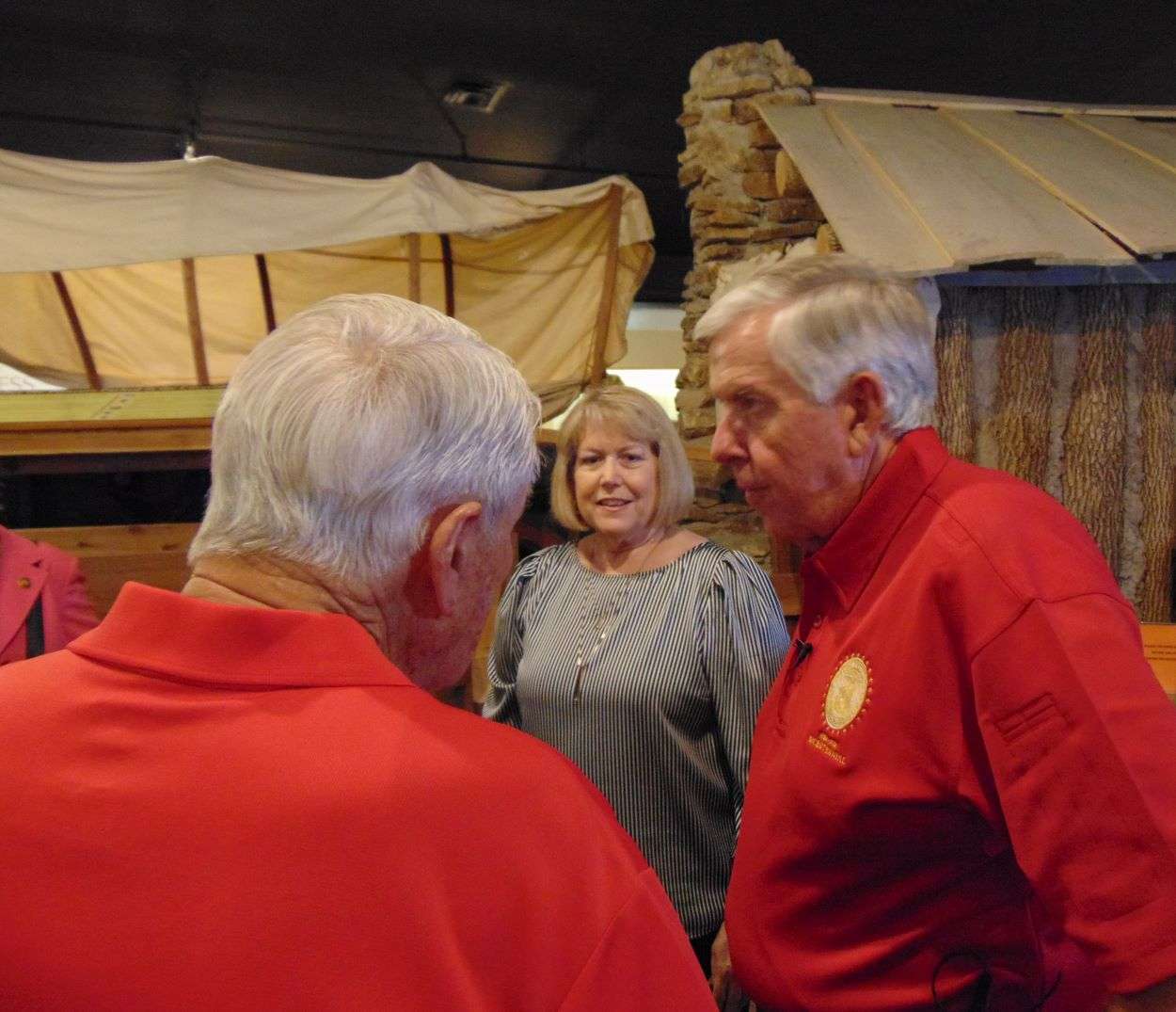 Gov. Parson and the First Lady listen to Pony Express Museum Board of Trustees President Dick Deshon during their visit.